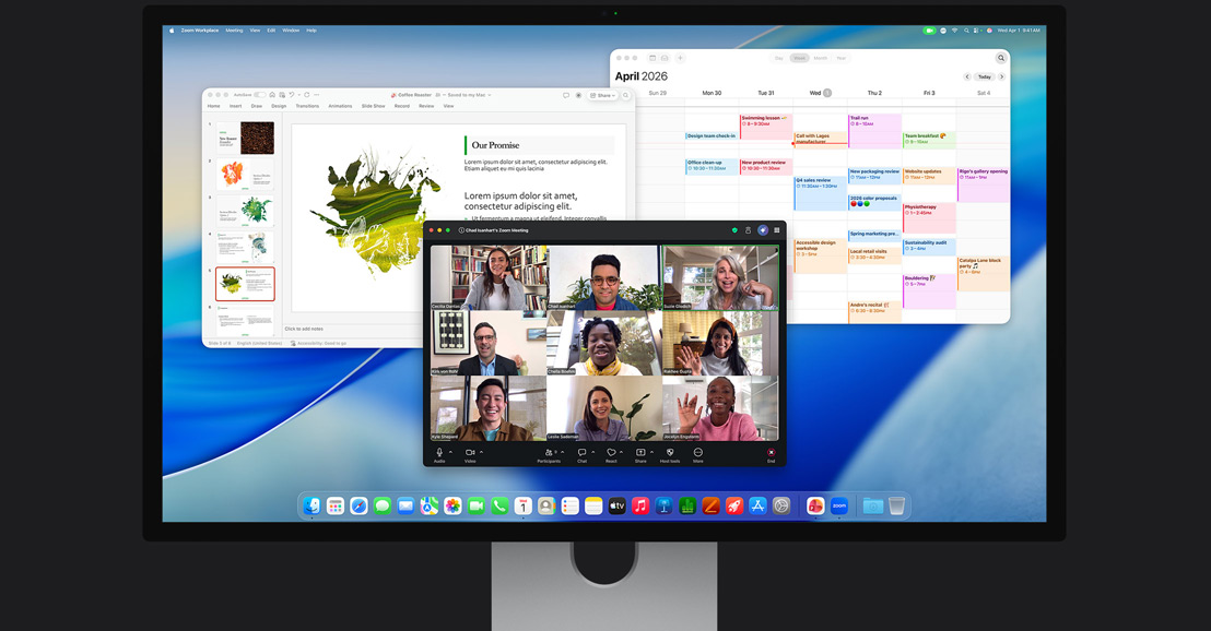 Auf dem Bildschirm eines iMacs ist ein Zoom Videoanruf mit mehreren Teilnehmer:innen zu sehen, daneben ein Kalender und eine im Hintergrund geöffnete Präsentation