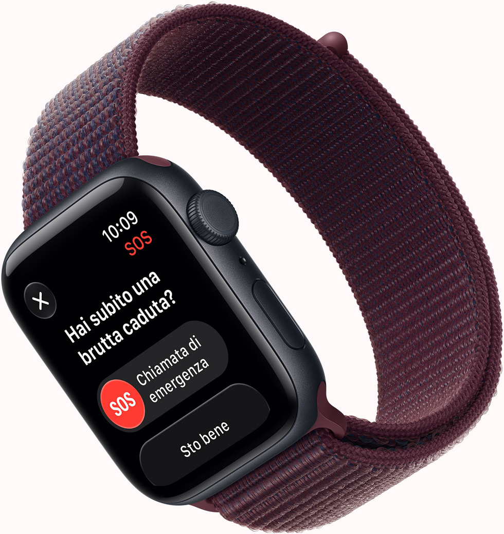 Apple Watch SE 3, screen shows SOS Fall Detection notification, emergency call button, aluminum case, midnight color, connected to Sport Loop band, burgundy color