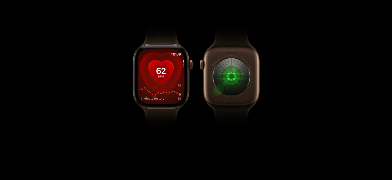 Two Apple Watch Series 12 devices, aluminium case, dark bronze colour, olive Sport Band, one showing front of watch with Heart Rate app, one showing back of watch with Health Sensing System with glowing green LED lights