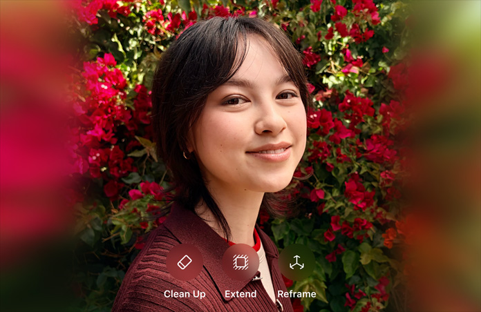 Fotografia de uma pessoa sorridente com cabelo castanho, vestida com uma camisola castanha e rodeada por flores vermelhas. Sobre a fotografia, uma demonstração de edição com IA apresenta as opções «Clean Up», «Extend» e «Reframe».