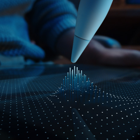 Apple Pencil Pro, λευκό χρώμα, η μύτη της συσκευής αιωρείται πάνω από την οθόνη του iPad δείχνοντας ένα πλέγμα από κουκκίδες με κάποιες να ανυψώνονται σε στήλες προς τη μύτη του Apple Pencil Pro