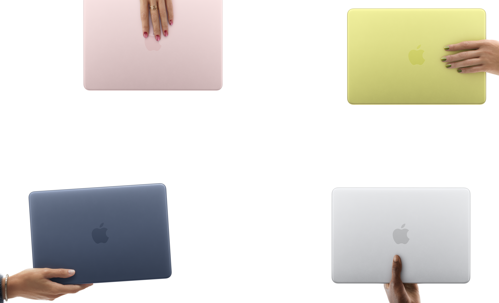 様々なカラーのMacBook Neoノートブック。それぞれを異なる人物の手が持っている