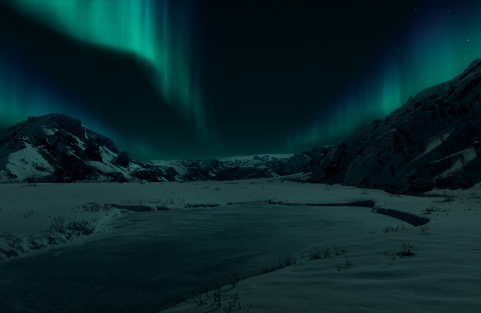 Apple Vision Pro Ansicht einer isländischen Landschaft mit schneebedeckten Bergen und Polarlichtern vor einem dunklen Hintergrund